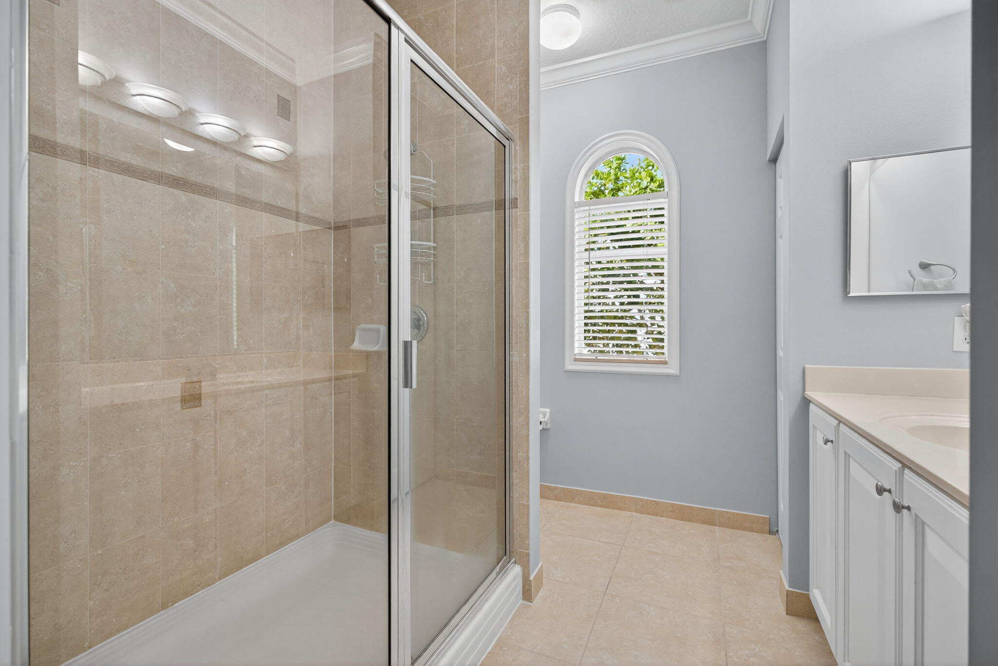 141 Seagrape Drive, Unit 203 Jupiter, FL 33458 - Photo 19 of 39 a bathroom with a shower and a sink