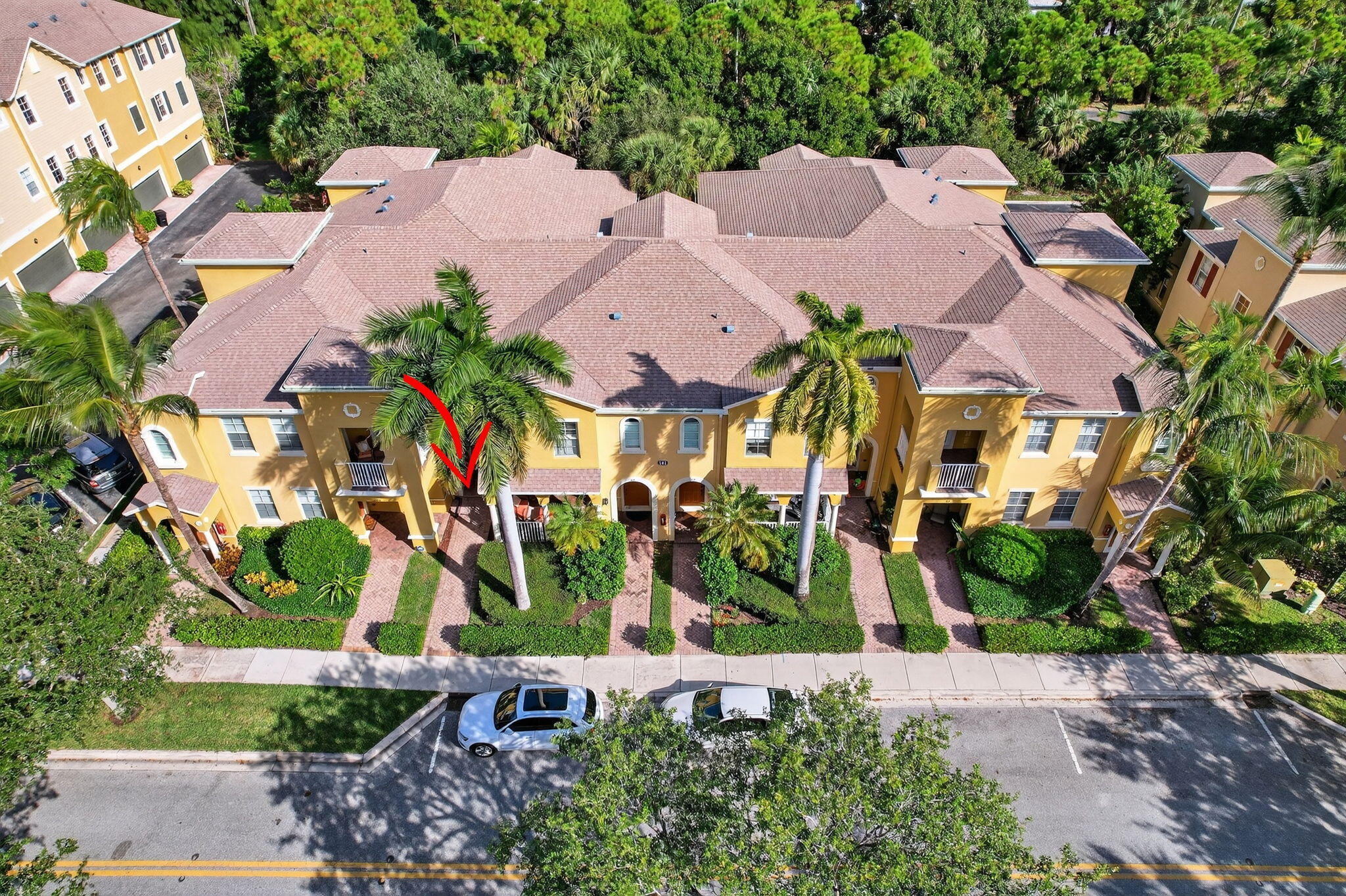 141 Seagrape Drive, Unit 203 Jupiter, FL 33458 - Photo 35 of 39 an aerial view of multiple houses with yard
