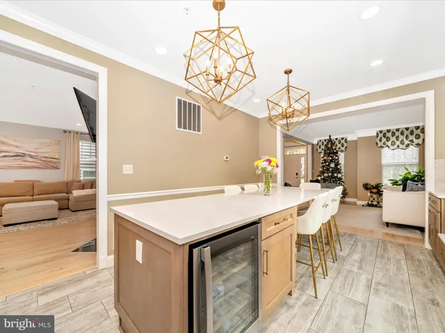 a large white kitchen with a large window