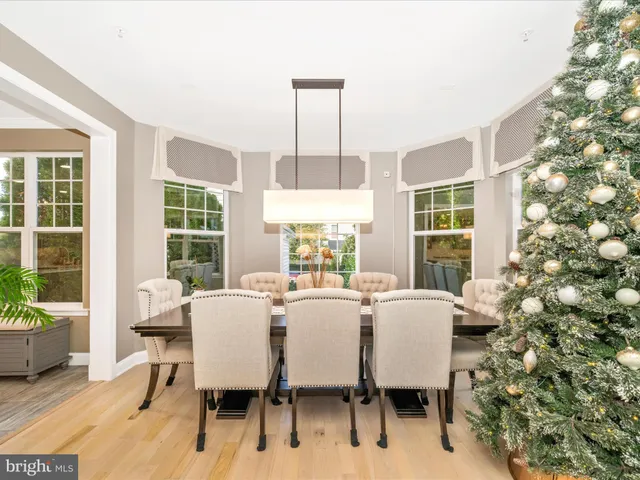 a spacious bedroom with a large bed a chandelier and closet