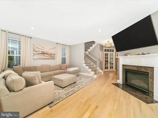 a spacious bedroom with a bed and a chandelier