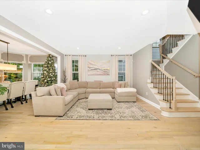 a spacious bathroom with a tub a sink and mirror