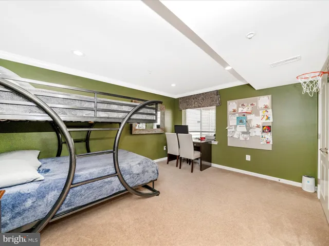 a view of pool with lawn chairs and plants