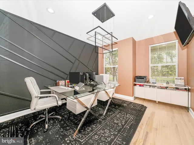 a large white kitchen with a large window