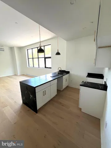 a kitchen with stainless steel appliances sink and cabinets
