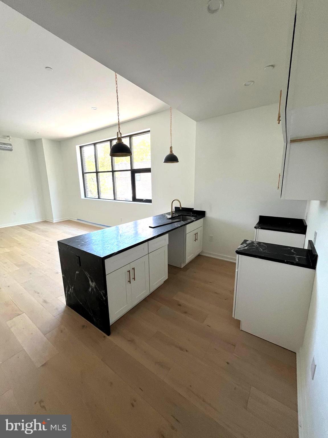 a kitchen with stainless steel appliances sink and cabinets