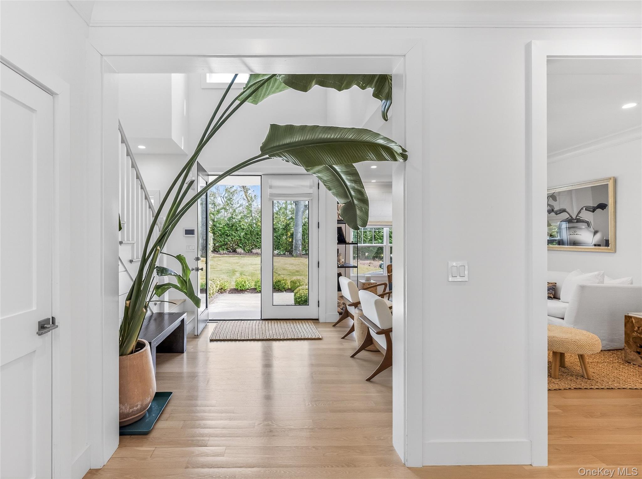 a view of an entryway with wooden floor