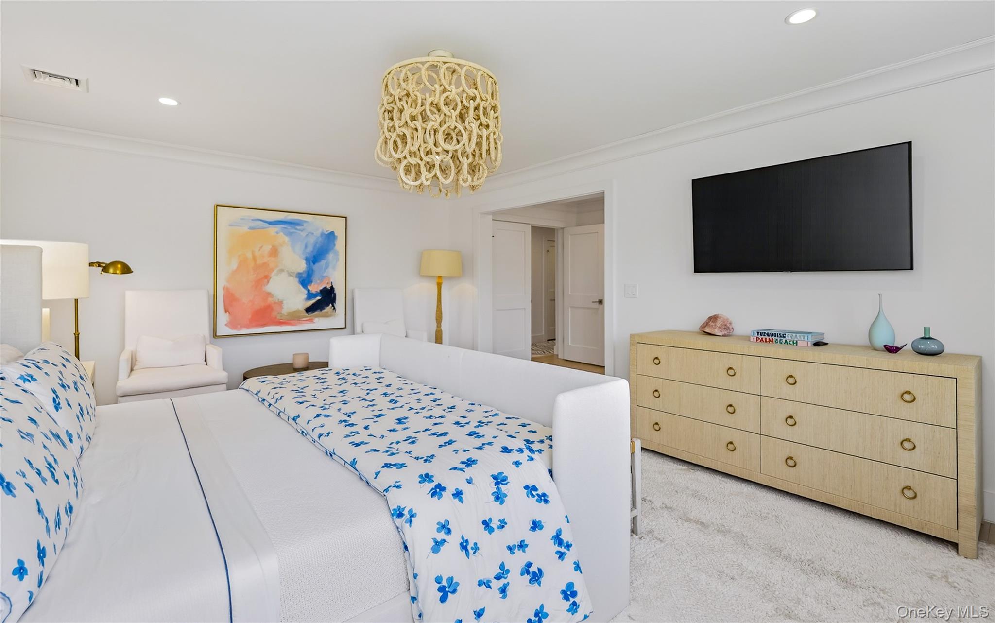 17 Bayview Road Southampton, NY 11968 - Photo 20 of 39 a bedroom with a bed and a flat screen tv