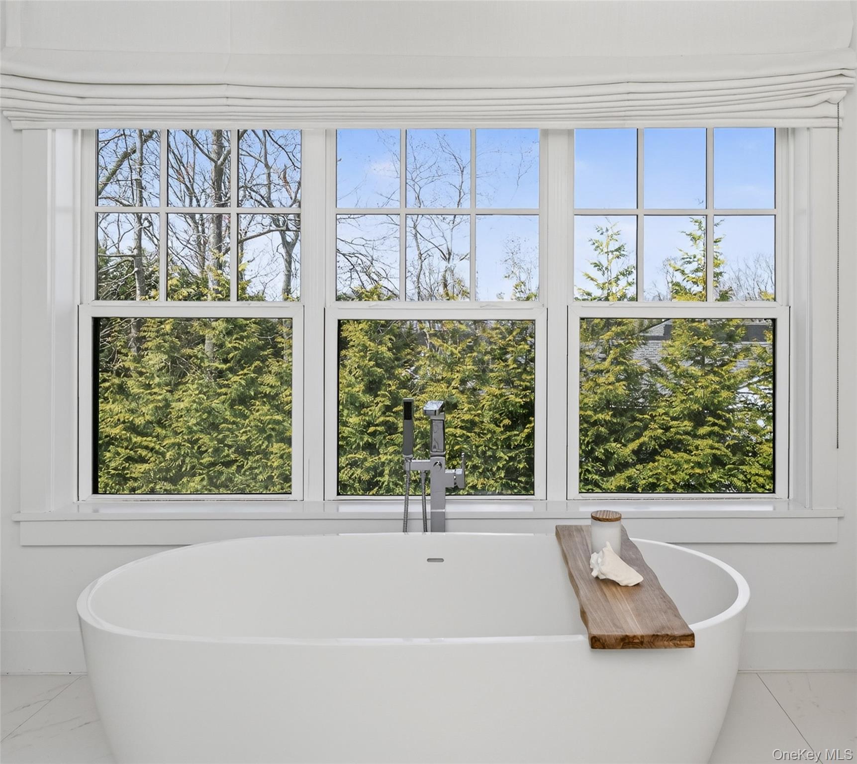 17 Bayview Road Southampton, NY 11968 - Photo 23 of 39 a bathroom with a bathtub and window