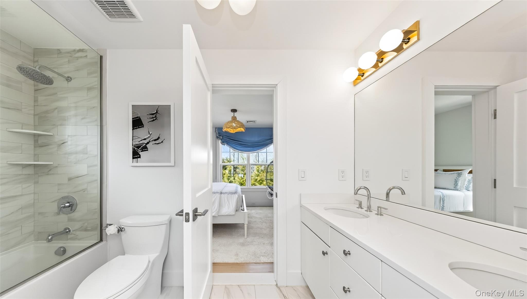 17 Bayview Road Southampton, NY 11968 - Photo 29 of 39 a bathroom with a toilet sink and shower