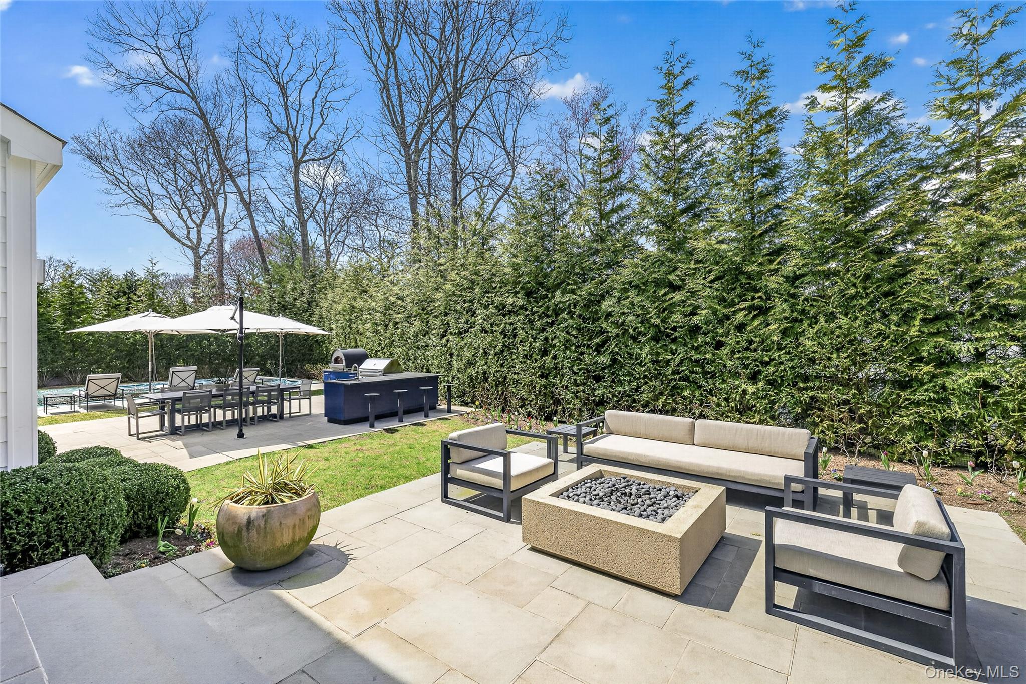 17 Bayview Road Southampton, NY 11968 - Photo 36 of 39 a view of a backyard with swimming pool and sitting area