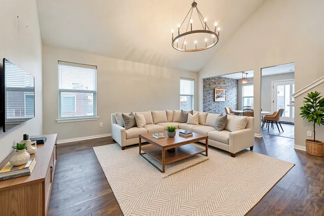 a living room with furniture rug and window