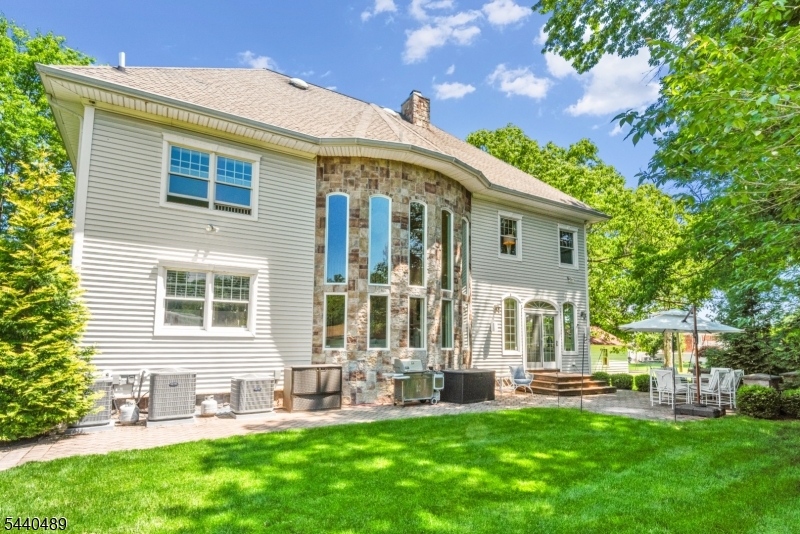 99 East Lindsley Road Cedar Grove, NJ 07009 - Photo 40 of 41 a front view of house with a garden and patio