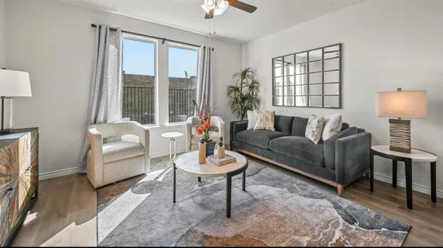 a living room with furniture and a large window
