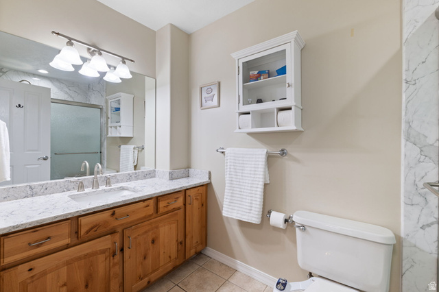 1625 Pages Pl Drive Bountiful, UT 84010 - Photo 15 of 31 Primary bath featuring a marble finish shower, vanity, and light tile patterned floors