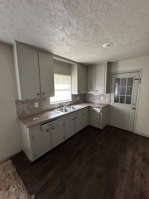 9122 Laura Koppe Road Houston, TX 77078 - Photo 3 of 9 a kitchen with granite countertop a sink a window and cabinets