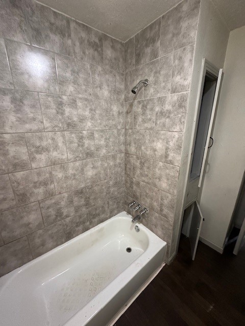 9122 Laura Koppe Road Houston, TX 77078 - Photo 5 of 9 a bathroom with a bathtub and shower