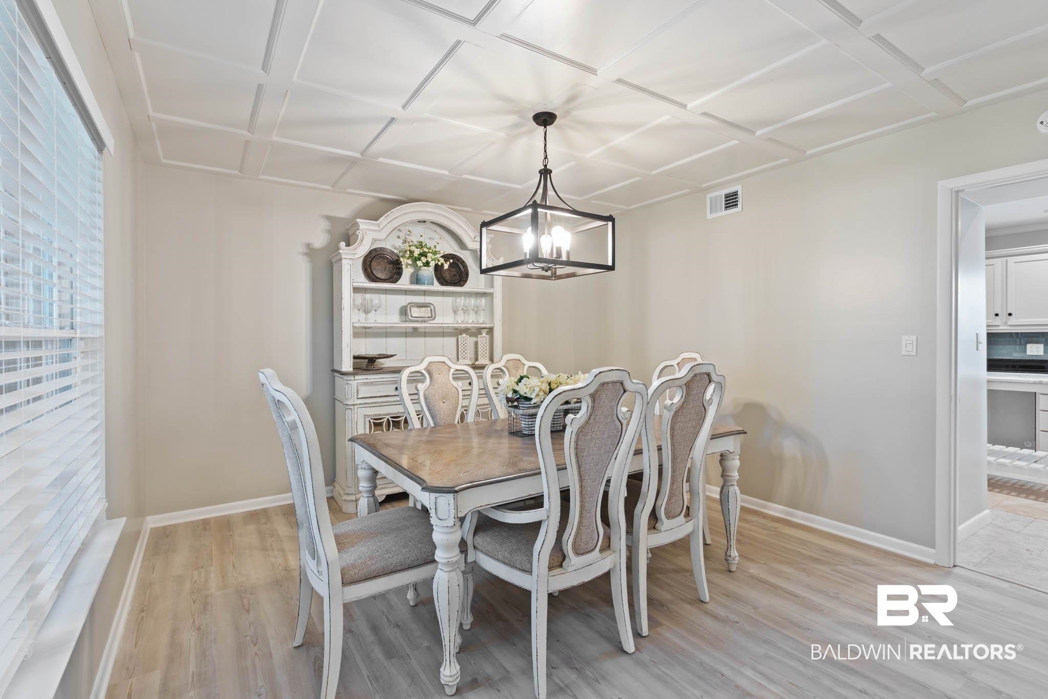 608 Southern Way Daphne, AL 36527 - Photo 7 of 35 Dining area featuring a chandelier, light wood-style flooring, and coffered ceiling