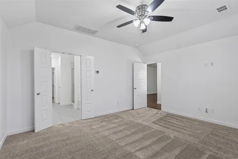 a view of a big room with a ceiling fan and a chandelier fan