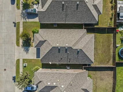 an aerial view of a house with a garden