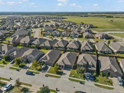 an aerial view of residential house with outdoor space and lake view