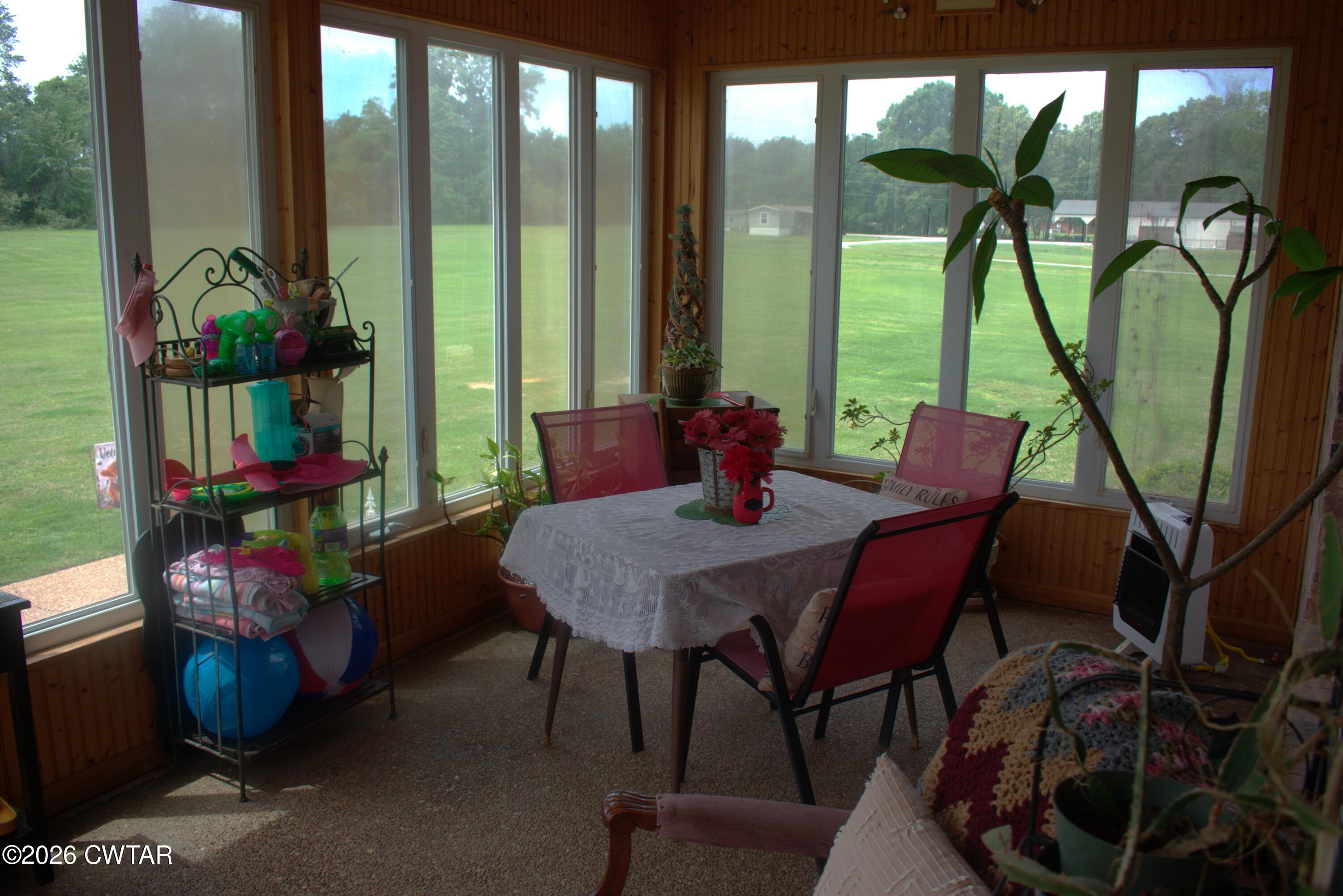808 Tower Road McKenzie, TN 38201 - Photo 13 of 19 a view of a dining room with furniture window and outside view