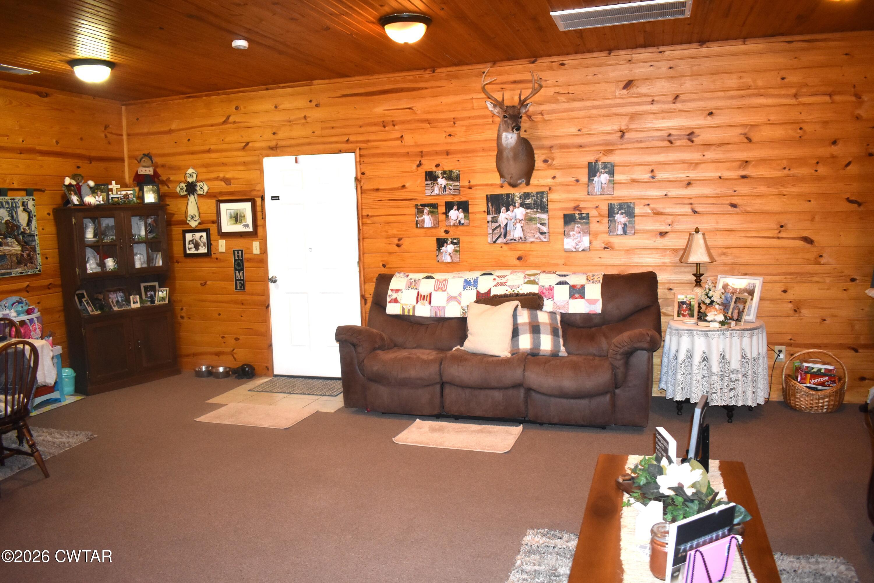 808 Tower Road McKenzie, TN 38201 - Photo 17 of 19 a living room with furniture and a flat screen tv