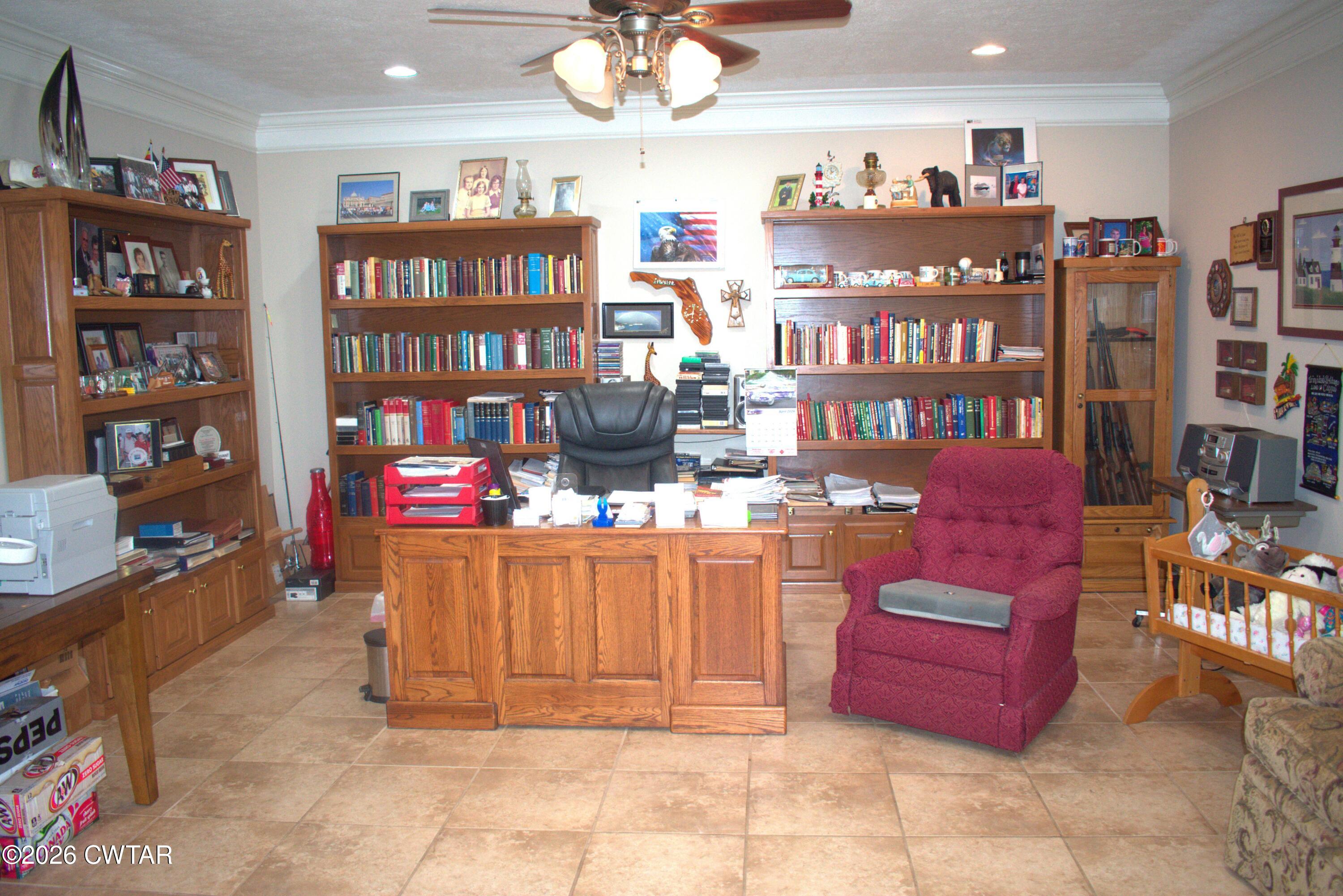 808 Tower Road McKenzie, TN 38201 - Photo 9 of 19 a room with bookshelf and a workspace