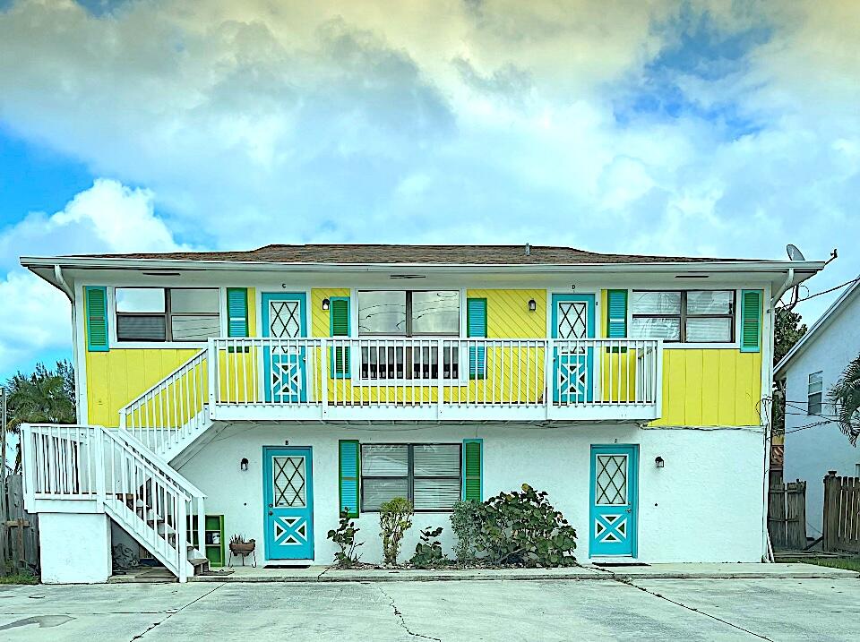 a front view of residential houses with yard