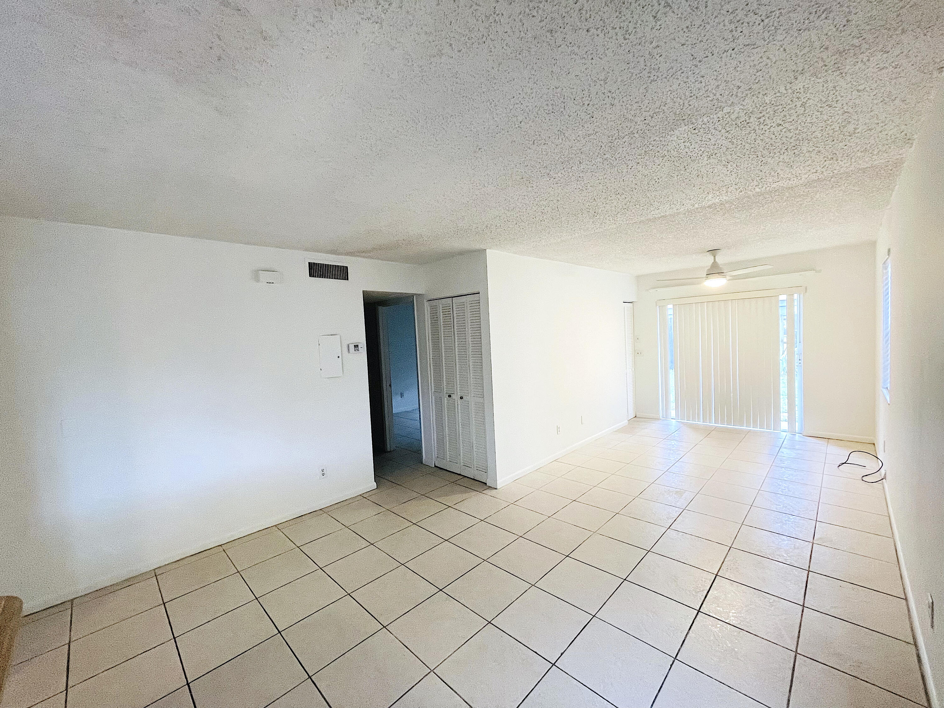 308 Hernando Street, Unit A Fort Pierce, FL 34949 - Photo 5 of 9 a view of an empty room and window