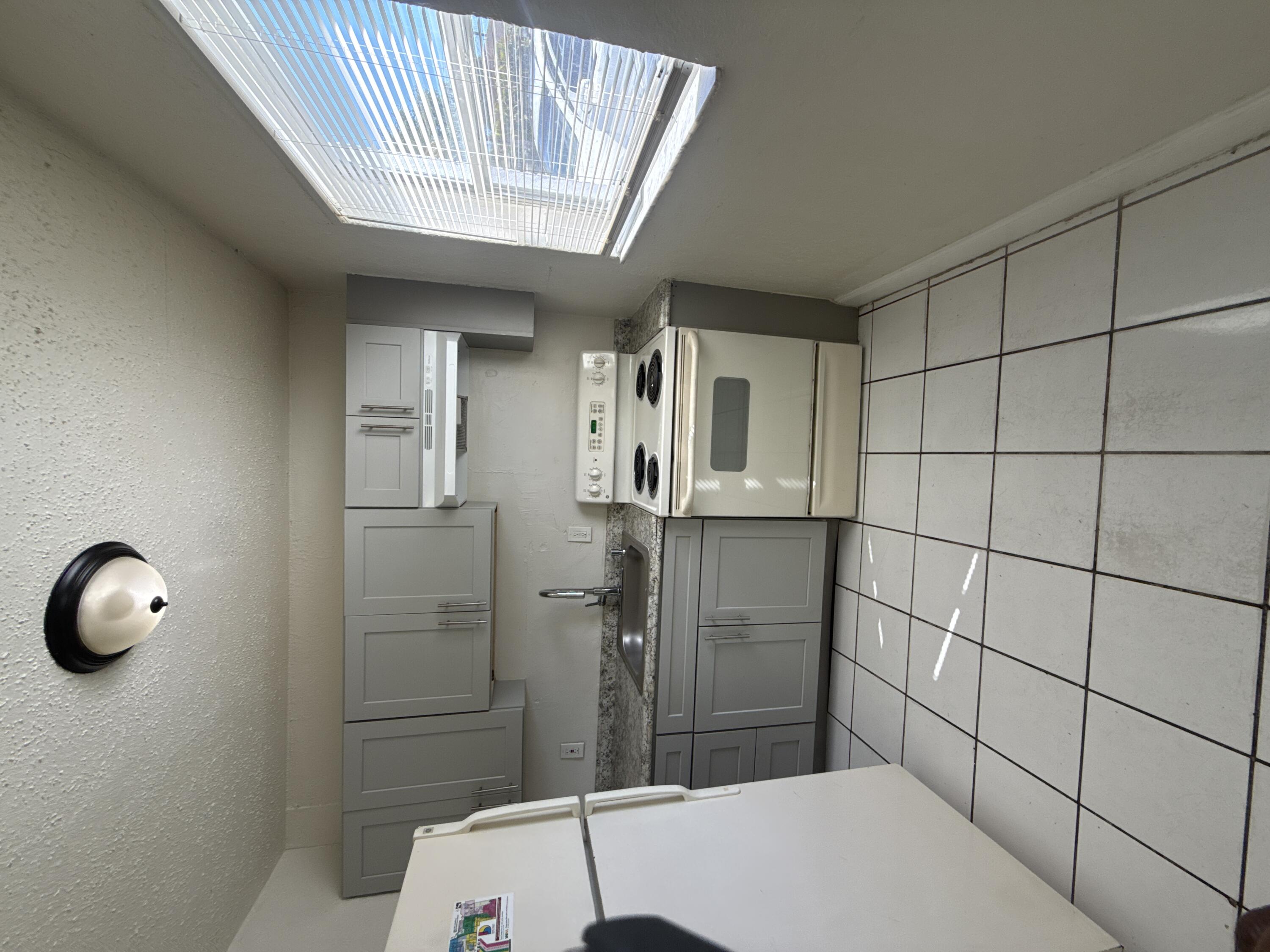 720 Southwest 7th Street, Unit 1 Dania Beach, FL 33004 - Photo 2 of 4 a bathroom with a sink a toilet and shower