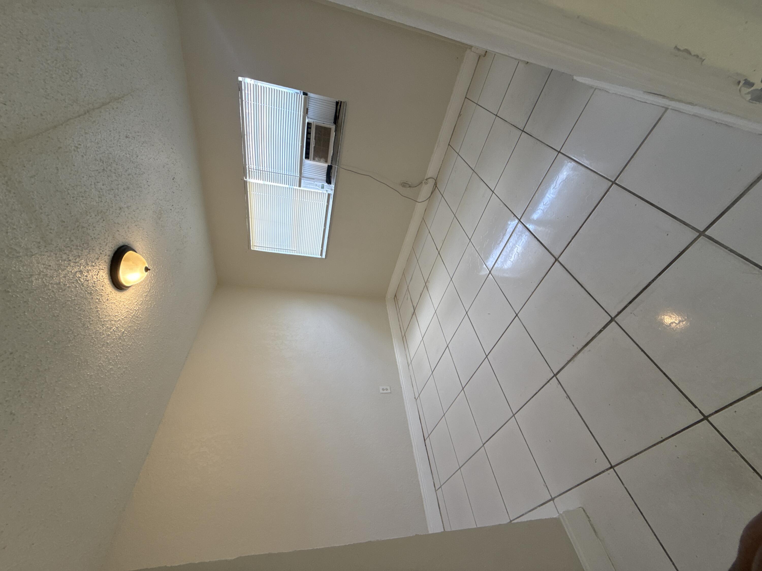 720 Southwest 7th Street, Unit 1 Dania Beach, FL 33004 - Photo 4 of 4 a view of a livingroom and entryway