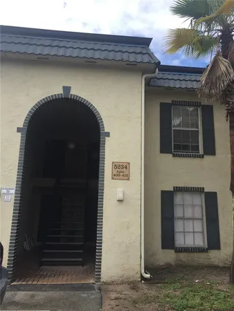 a front view of a house with an outdoor space