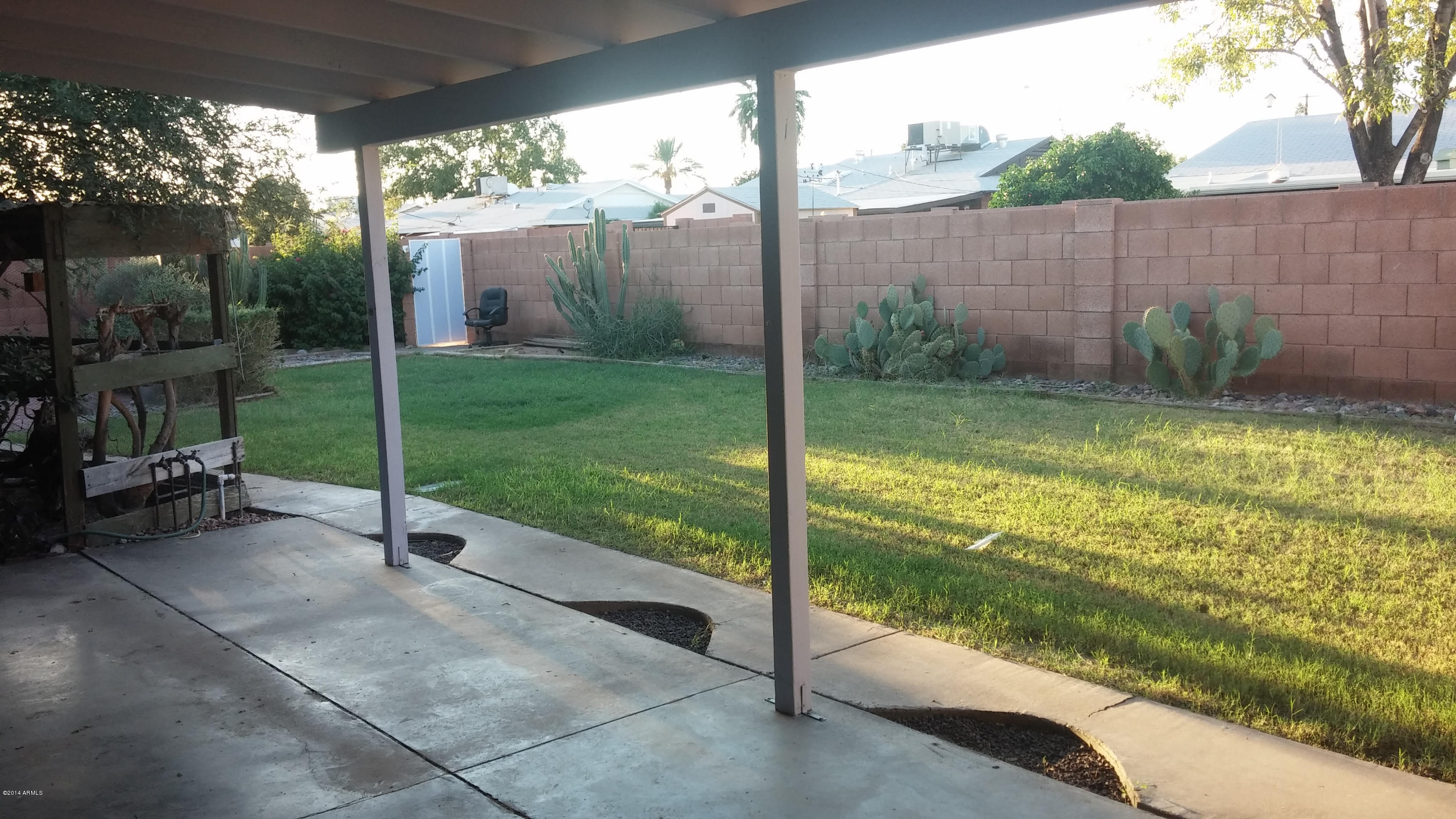 3926 West McLellan Boulevard Phoenix, AZ 85019 - Photo 1 of 14 a view of a porch with a yard