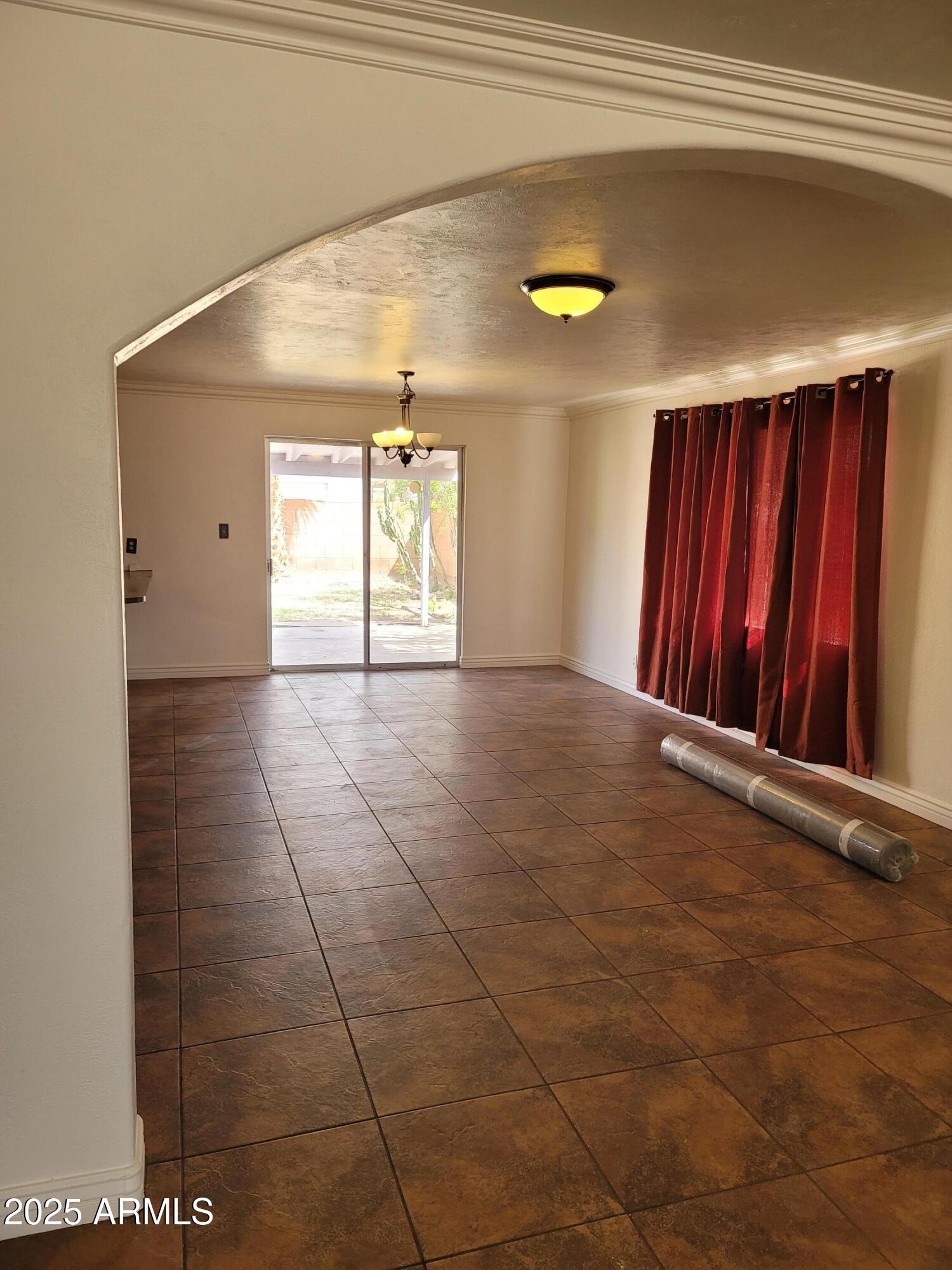 3926 West McLellan Boulevard Phoenix, AZ 85019 - Photo 6 of 14 a view of an empty room with windows