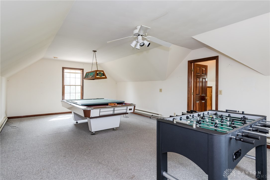 9981 Ridge Acres Lane Englewood, OH 45322 - Photo 43 of 73 This spacious bonus room features sloped ceilings and ample light, perfect for recreation and entertaining.