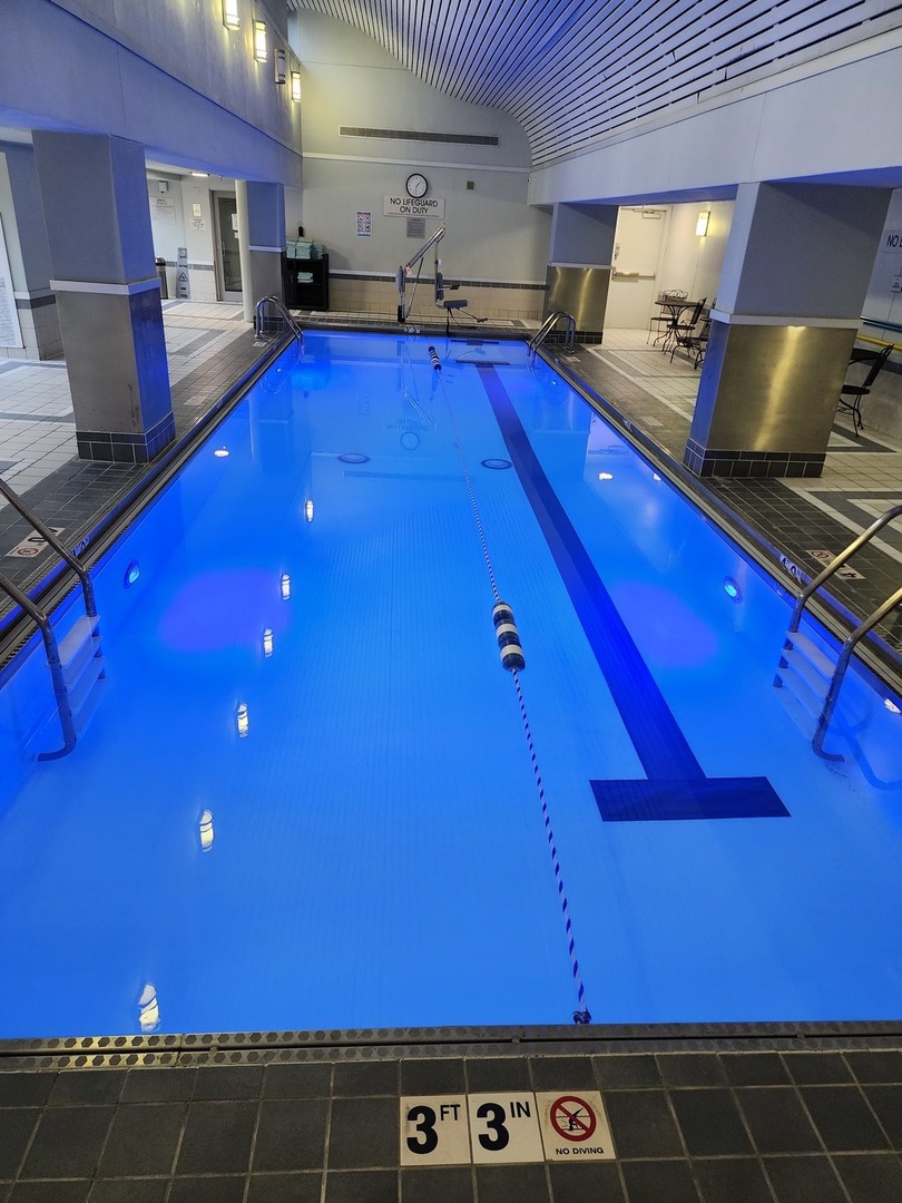 440 North Wabash Avenue, Unit 3109 Chicago, IL 60611 - Photo 13 of 25 a kitchen with stainless steel appliances a sink stove and cabinets
