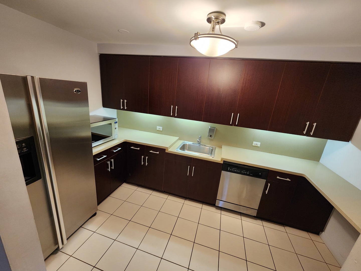 440 North Wabash Avenue, Unit 3109 Chicago, IL 60611 - Photo 19 of 25 a kitchen with a sink and cabinets