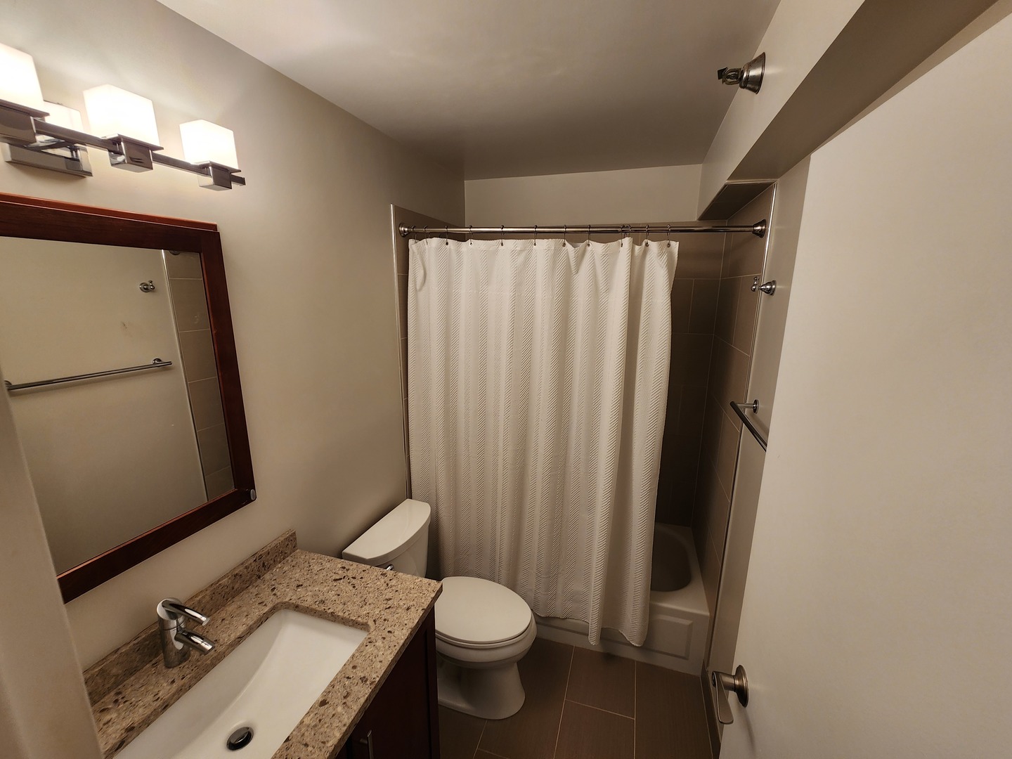 440 North Wabash Avenue, Unit 3109 Chicago, IL 60611 - Photo 8 of 25 a bathroom with a granite countertop sink toilet and shower