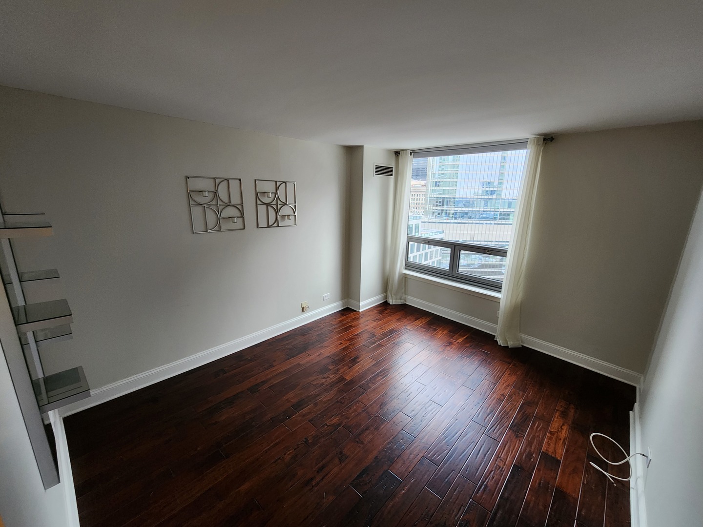 440 North Wabash Avenue, Unit 3109 Chicago, IL 60611 - Photo 9 of 25 wooden floor in an empty room with a window
