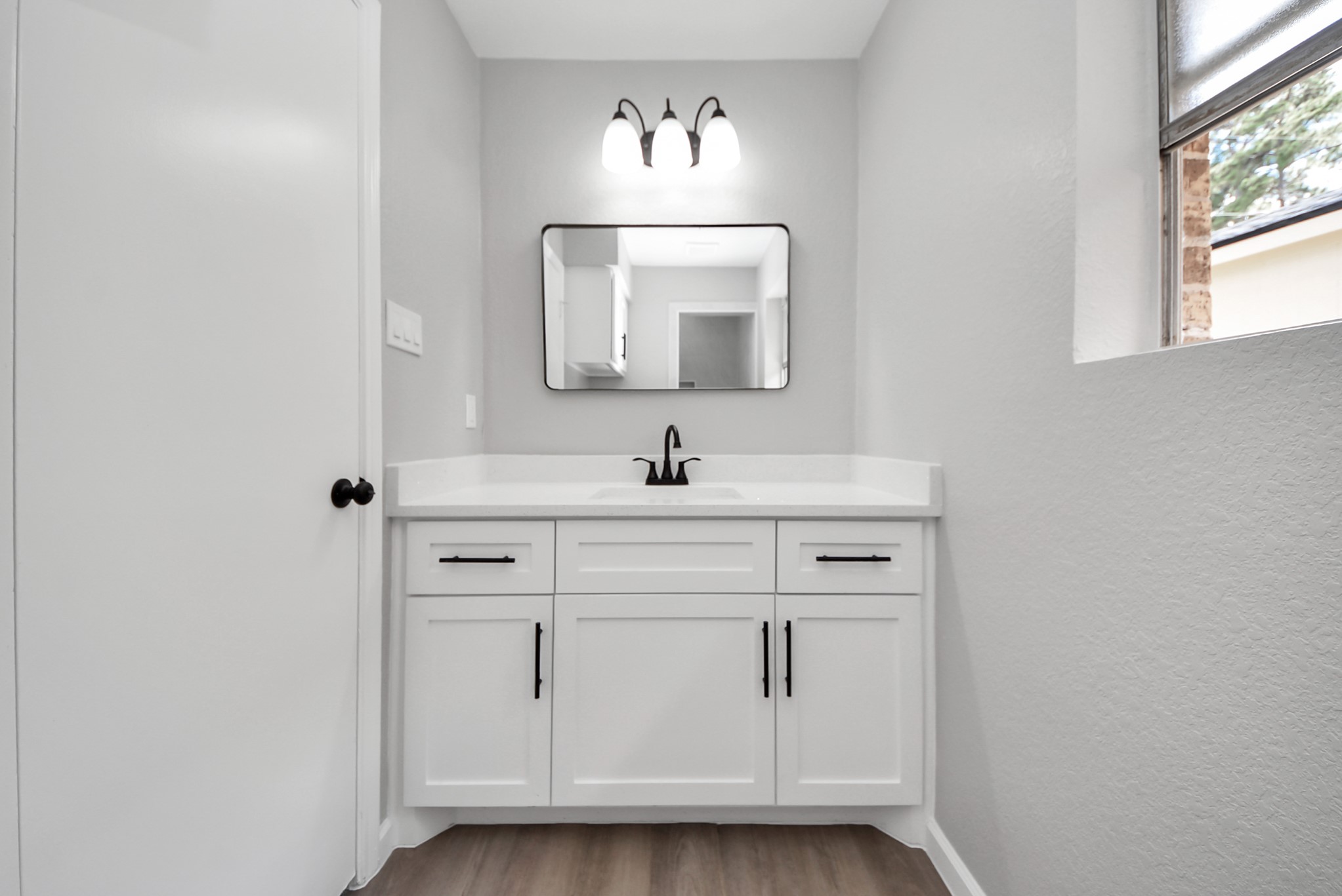 2402 Rolling Glen Drive Spring, TX 77373 - Photo 29 of 38 a bathroom with a sink vanity and a mirror