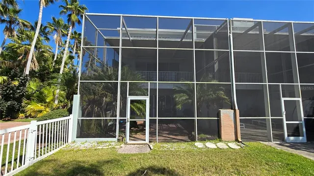 a view of a chairs and table in the patio