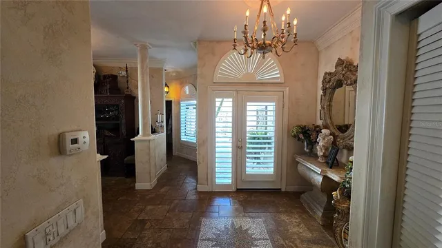 a living room with furniture a window and a flat screen tv