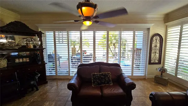 a view of a livingroom with a hall and stairs
