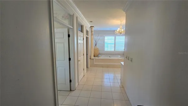a view of a hallway view with three rooms