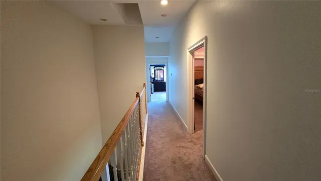 a bathroom with a toilet a sink and glass door