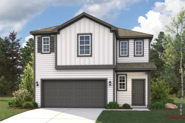 a front view of a house with garage