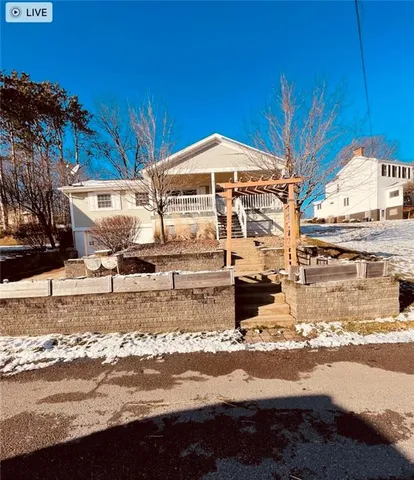 a view of a house with a street