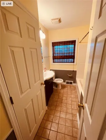 a view of a bathroom with a sink and a mirror