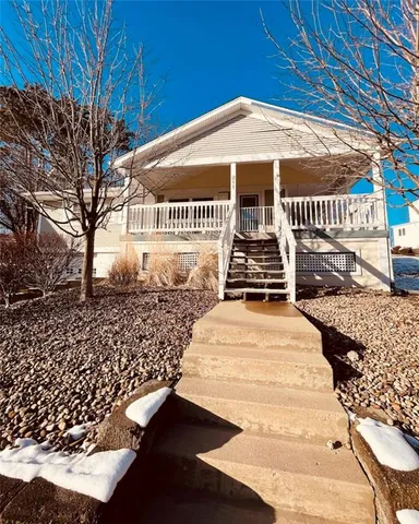 a front view of a building with garden